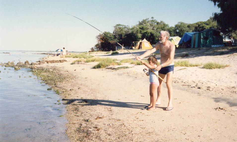 My sister, Claire, and Grandad fishing at our piece of beach (circa 1987)